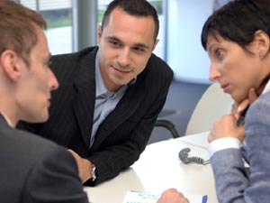 Three people in a meeting