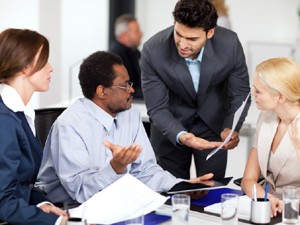 Four business people in a discussion